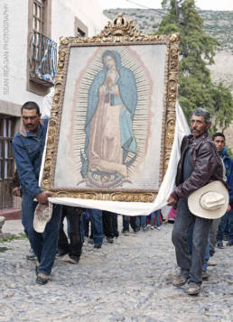 Men carry a portrait of the Virgen of Guadalupe in Real de Catorce, Mexico